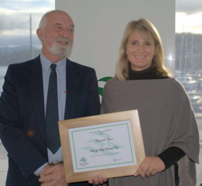 CLub Vice Commodore Felicity Allison accepted the Club of the Year award from Ron Bugg